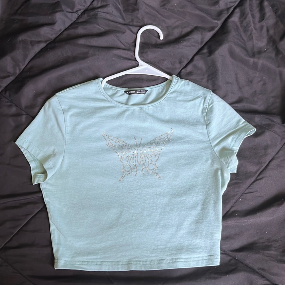 light green crop top. I an selling because its just not my style anymore